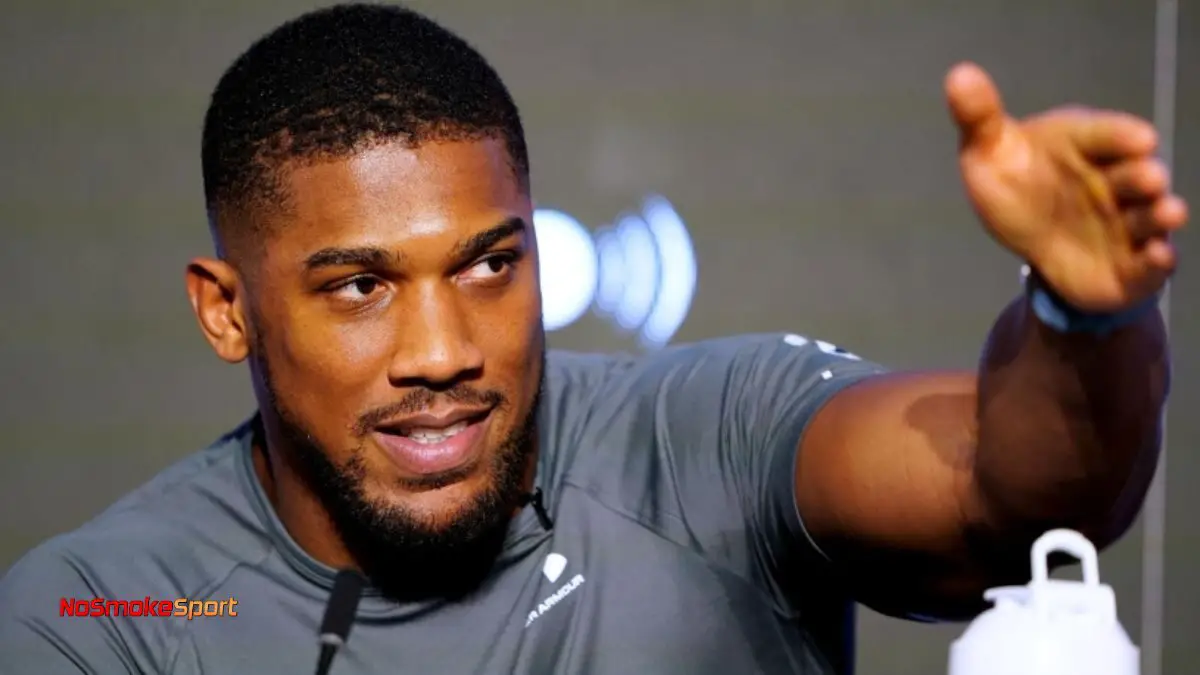 Anthony Joshua in training, contemplating potential new opponents in the heavyweight boxing division