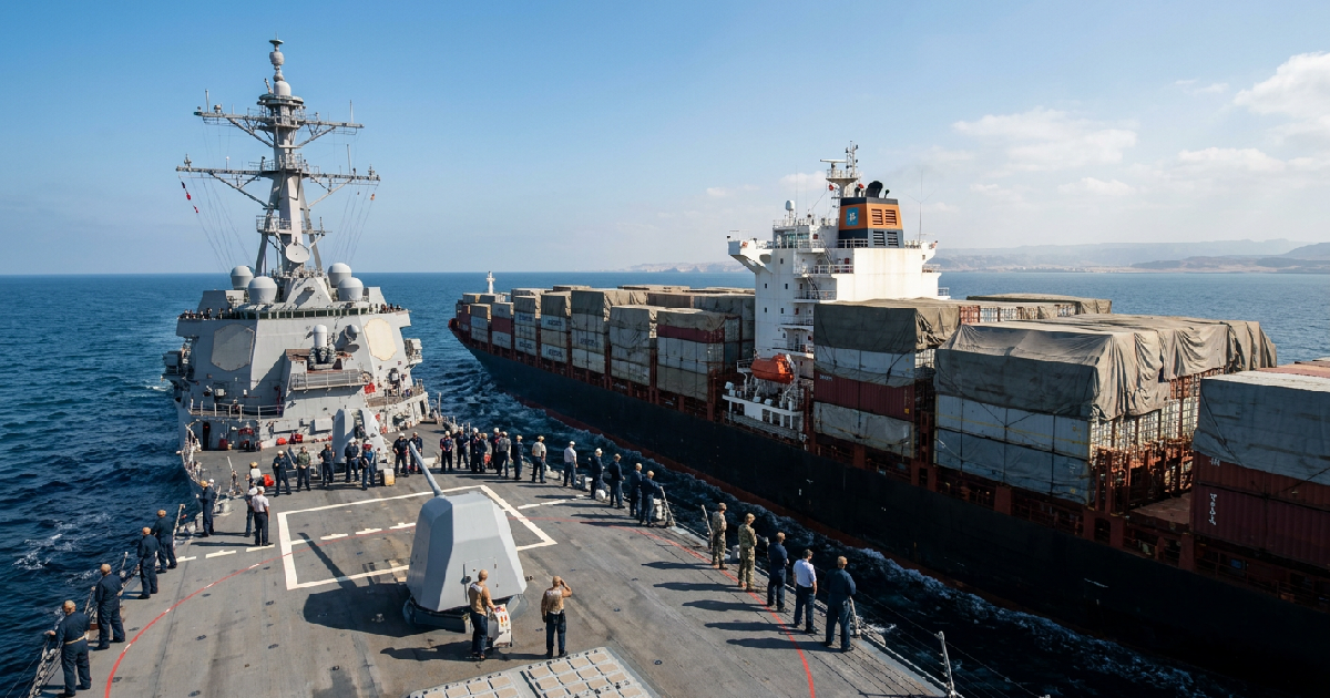 US naval forces redirect commercial vessels during maritime blockade against Iran